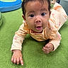Naira joined the competition — help win amazing prizes! baby, infant, child, tummy_time, pointing, wide_eyed, surprised, curly_hair, smiling, portrait, indoor, playroom, carpet, play_equipment, pink_clothing, long_sleeves, floor, close_up, sitting, family