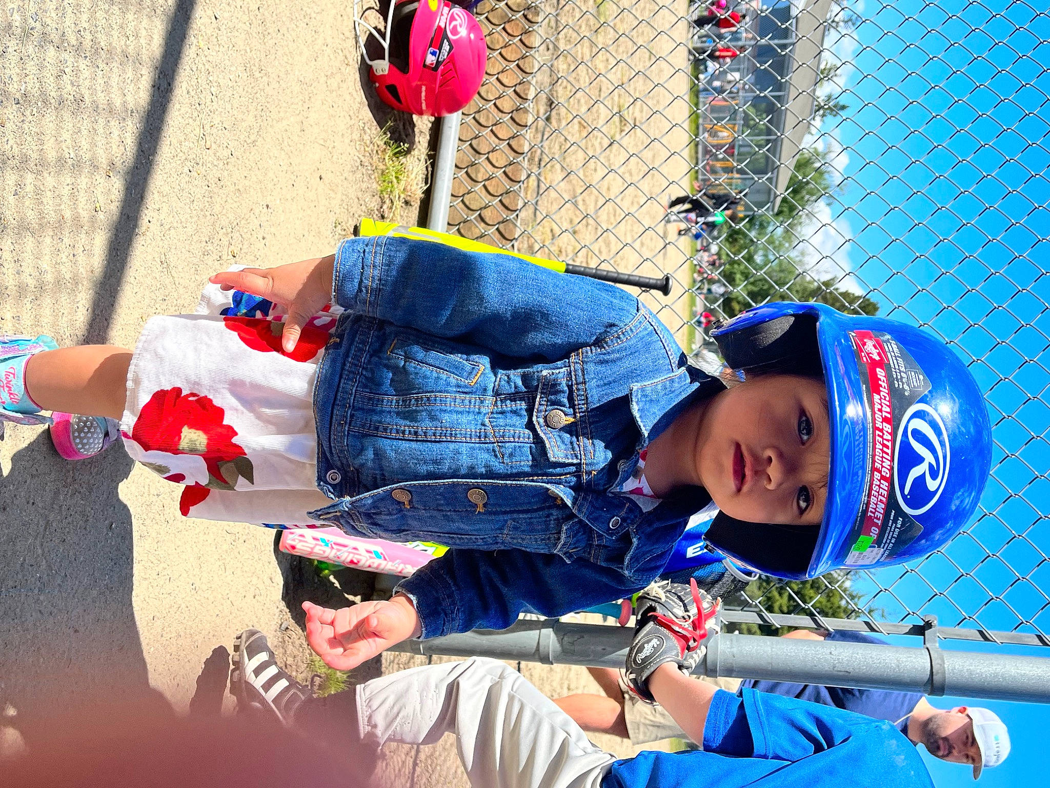 Maya is registered to the contest to win money with this photo: arm, baseball, baseball_equipment, baseball_player, bat_and_ball_games, blue, child, clothing, college_baseball, electric_blue, fence, fun, headwear, helmet, leisure, mesh, person, player, sports_equipment, sports_gear