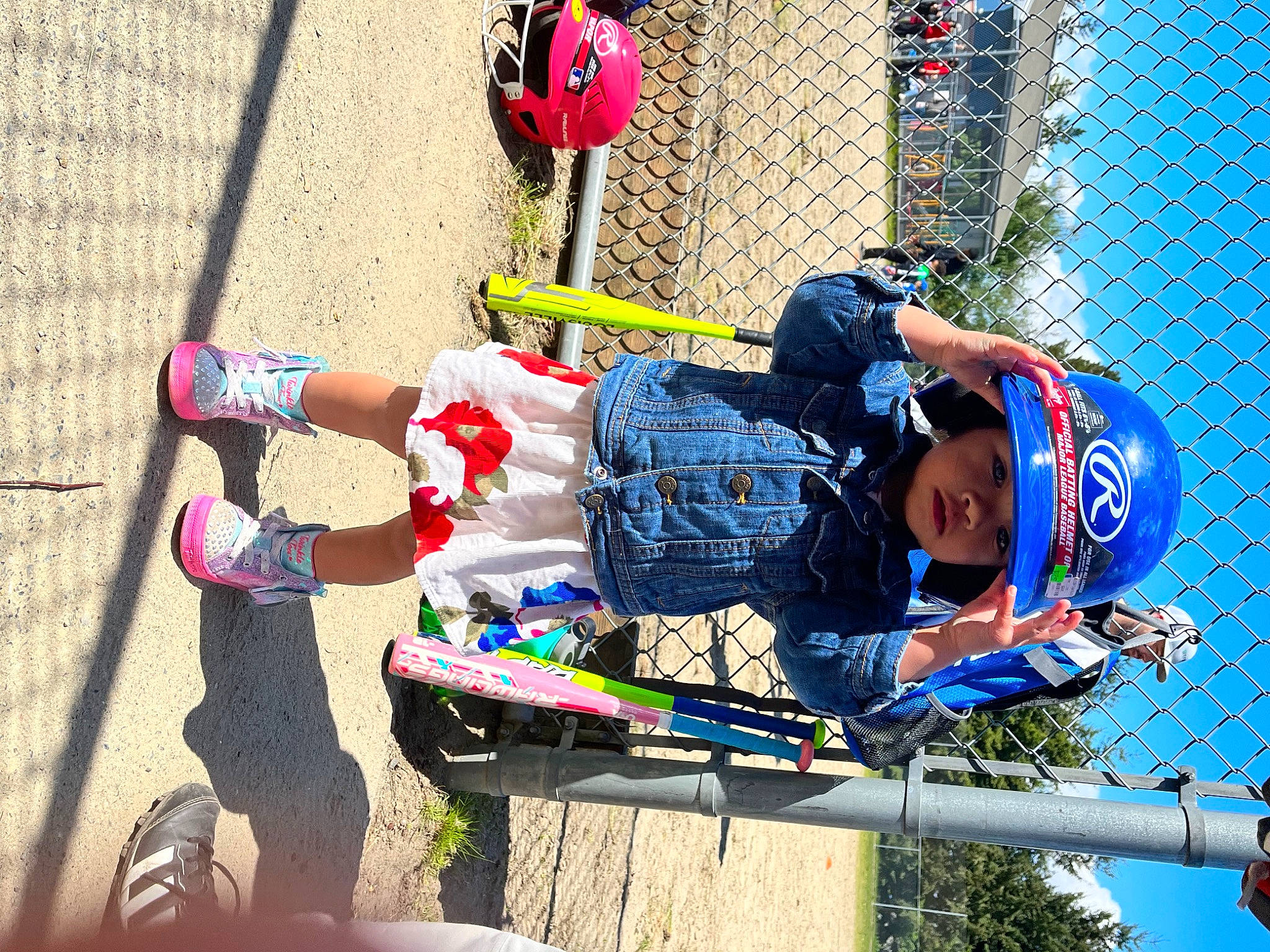 Maya joined the competition — help win amazing prizes! bicycle_helmet, child, city, electric_blue, fence, fun, headwear, helmet, leisure, mesh, outdoor_play_equipment, person, personal_protective_equipment, play, recreation, sports, sports_equipment, tire, toddler, tree