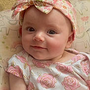 Abigail joined the competition — help win amazing prizes! baby, child, infant, headband, floral, dress, smile, face, portrait, cute, pink, pattern, unicorn, rainbow, cushion, soft, indoors, person, happy, apparel