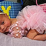 baby, infant, pink_tutu, headband, polka_dot, blanket, easter_basket, bunny, soft_texture, sleepy, cute, adorable, child, portrait, indoors, resting, newborn, fabric, colorful, celebration