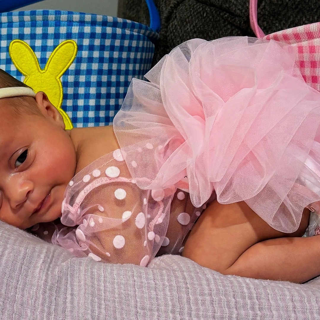 Iyonna is registered to the contest to win money with this photo: baby, infant, pink_tutu, headband, polka_dot, blanket, easter_basket, bunny, soft_texture, sleepy, cute, adorable, child, portrait, indoors, resting, newborn, fabric, colorful, celebration