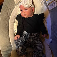 Lorelei joined the competition — help win amazing prizes! baby, black_outfit, blanket, child, cushion, face, fashion, flower, headband, home, houndstooth_pants, indoor, infant, infant_seat, looking_away, portrait, ruffled_sleeves, safe_sleep_warning, sitting, socks