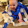 baby, child, smiling, birthday, streamers, blue, crawling, floor, home, celebration, happy, cute, infant, decorations, party, person, young, face, playful, fun