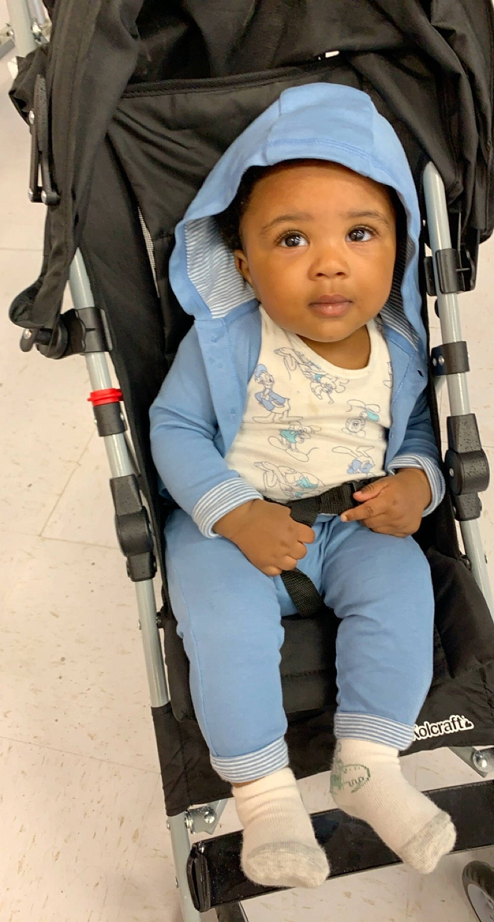 Kyro is registered to the contest to win money with this photo: baby, baby_carriage, baby_products, baby_safety, baby_toddler_clothing, child, comfort, electric_blue, eye, fashion_accessory, fun, headwear, knee, person, photograph, product, recreation, sitting, sock, street_fashion