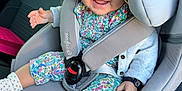 Lyna participe au concours pour gagner de l'argent avec cette photo : baby, baby_clothing, car_interior, car_seat, child, colorful_clothes, cute, floral_pattern, happy, hat, headwear, indoors, infant, portrait, seatbelt, secure, sitting, smiling, socks, young_child