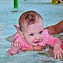 Frankie joined the competition — help win amazing prizes! baby, child, water, pool, swimming, pink_clothing, smile, splashing, adult_arm, safety, fun, play, wet_hair, cute, infant, summer, outdoor_activity, happiness, support, person