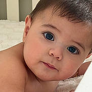 Milan joined the competition — help win amazing prizes! baby, infant, face, eyes, close_up, skin, expression, lying_down, soft_texture, indoors, portrait, cute, child, young, head, hair, looking, resting, peaceful, newborn