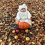 baby, pumpkin, autumn_leaves, apples, number_three, outdoor, fall, seasonal, cute, child, hat, white_clothing, nature, leaf_litter, sitting, portrait, milestone, season, holiday, cozy
