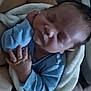 Reuben is registered to the contest to win money with this photo: newborn, baby, sleeping, infant, blanket, blue_clothing, hands, face, cozy, closeup, soft_light, peaceful, resting, portrait, child, human, indoors, skin, head, cute