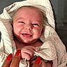 Penelope joined the competition — help win amazing prizes! newborn, baby, infant, smiling, happy, portrait, face, eyes, mouth, swaddled, blanket, hands, adult_hand, red_nails, cuddling, indoor, close_up, cozy, bed, photography
