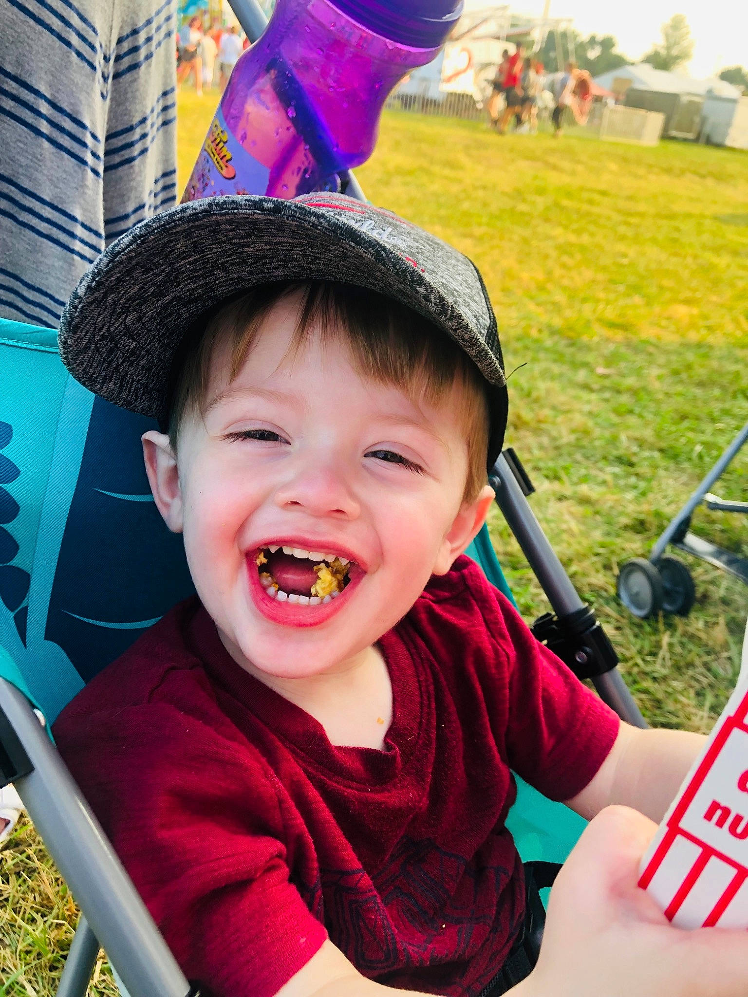 Emmett joined the competition — help win amazing prizes! baby, blue, cap, child, costume_hat, fun, grass, green, happy, hat, leisure, person, photograph, pink, plant, recreation, red, smile, sun_hat, toddler