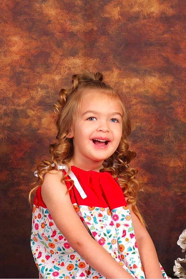 Jewell is registered to the contest to win money with this photo: beauty, child, dress, eye, facial_expression, flash_photography, fun, hair, hairstyle, happy, head, human_body, iris, joy, people, people_in_nature, person, photograph, skin, smile