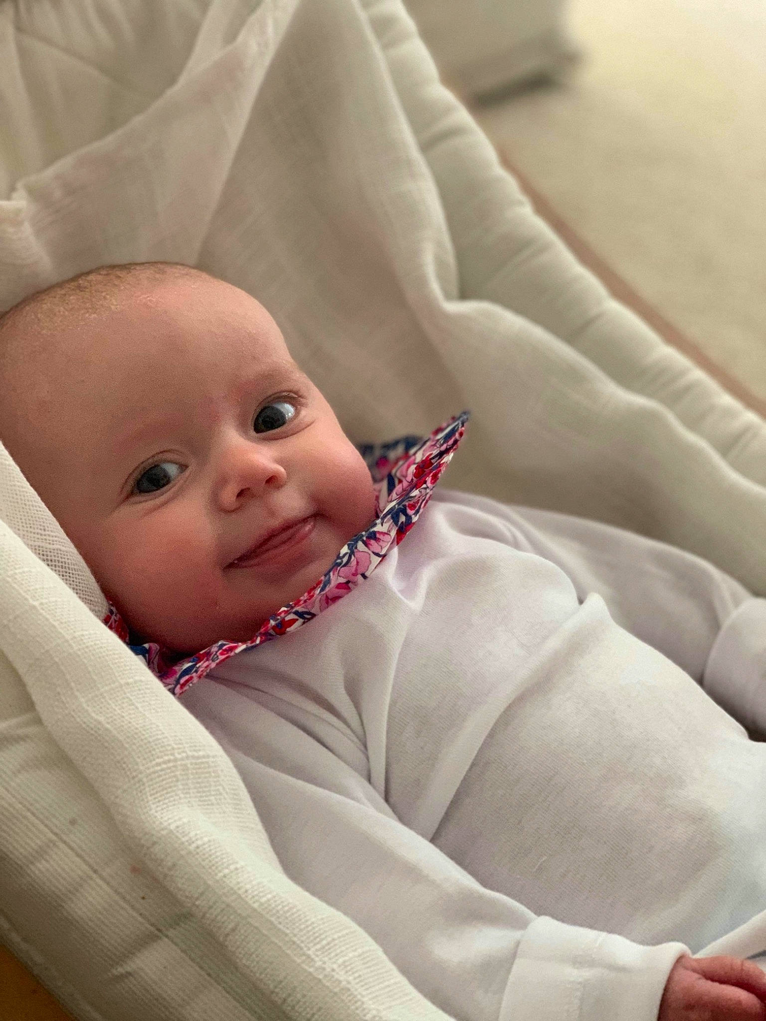 Viktoria a rejoint le concours — aidez-le/la à gagner de superbes lots ! baby, baby_products, baby_toddler_clothing, bedding, cheek, child, comfort, eyebrow, face, facial_expression, linens, lip, mouth, person, sitting, skin, sleeve, smile, textile, throw_pillow