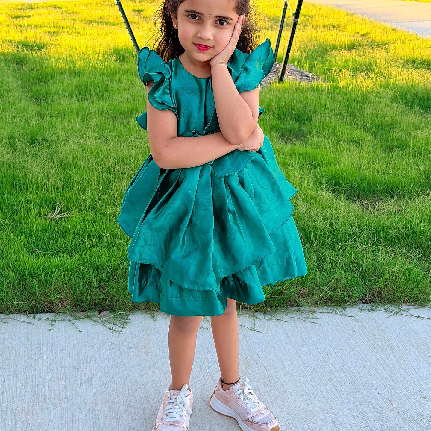 Aadvi joined the competition — help win amazing prizes! child, girl, dress, green_dress, sneakers, sidewalk, grass, outdoor, pose, smile, curly_hair, sunlight, street, playful, casual, fashion, young, person, portrait, daylight