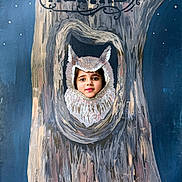 Aadvi joined the competition — help win amazing prizes! child, face, owl, tree, painting, cutout, portrait, blue, background, stars, costume, playful, outdoor, art, wood, expression, framed, young, smiling, creative