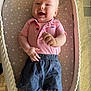 baby, smiling, infant, polo_shirt, shorts, star_pattern, cushioned_mat, lying_down, happy, child, indoor, skin, face, hand, legs, clothing, comfort, casual, cute, portrait