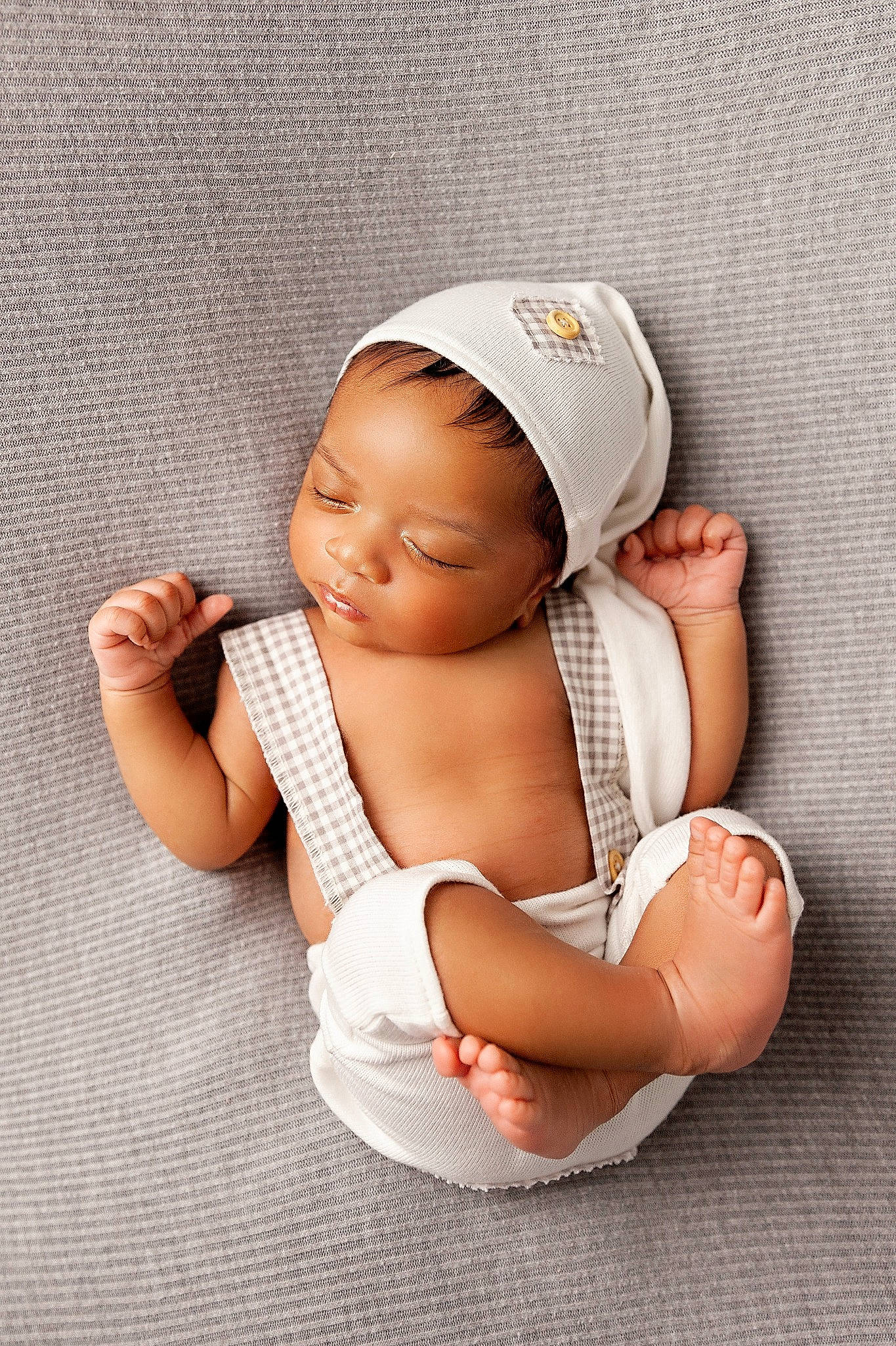 Jalen is registered to the contest to win money with this photo: baby, baby_safety, baby_sleeping, baby_toddler_clothing, cap, comfort, face, finger, foot, gesture, human_body, human_leg, knee, linens, nail, person, sleeve, sock, thigh, thumb