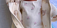 Lara joined the competition — help win amazing prizes! newborn, baby, sleeping, infant, clothing, onesie, footed_pajamas, bear_print, floral_pattern, soft_texture, blanket, bed, resting, peaceful, cute, child, indoors, portrait, human, cozy