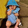 Kenzo joined the competition — help win amazing prizes! baby, child, denim_hat, blue_onesie, pacifier, couch, yellow_cushion, brown_couch, smiling, happy, infant, indoors, cute, playful, hand, foot, face, toddler, seated, comfort