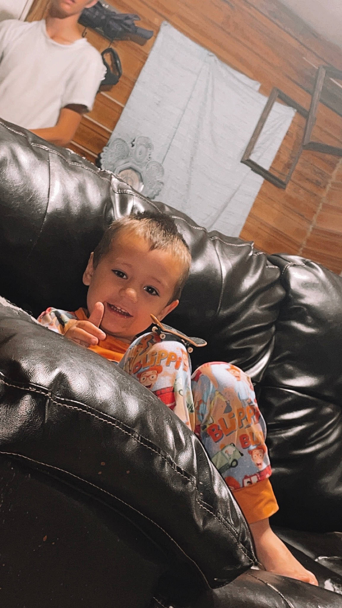 Jensen is registered to the contest to win money with this photo: auto_part, automotive_design, automotive_tire, automotive_wheel_system, child, comfort, flash_photography, fun, human_leg, joy, living_room, motor_vehicle, person, rim, sitting, smile, synthetic_rubber, tire, tire_care, toddler