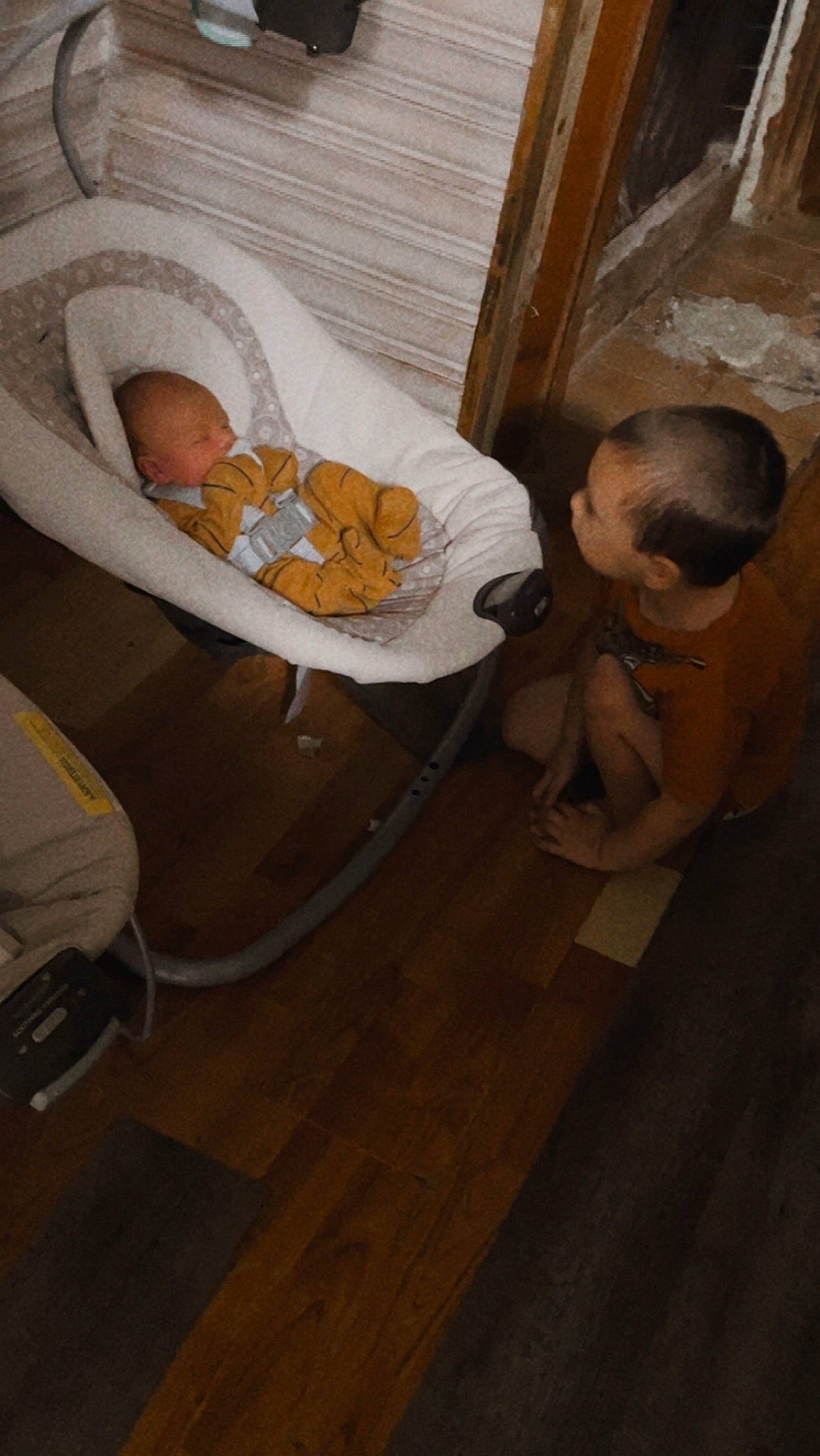 Jensen is registered to the contest to win money with this photo: baby, baby_products, baby_safety, baby_sleeping, child, comfort, cradle, flooring, fun, hardwood, infant_bed, linens, person, room, sitting, toddler, varnish, wood, wood_flooring, wood_stain