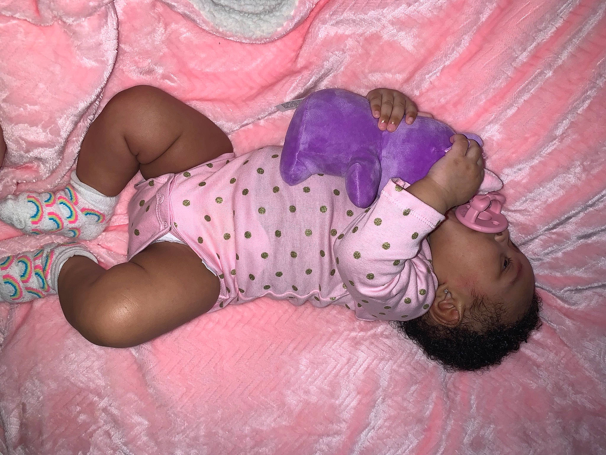 Avani is registered to the contest to win money with this photo: abdomen, baby, baby_bloomers, baby_toddler_clothing, barefoot, child, foot, human_body, nap, nightwear, person, pink, polka_dot, sleep, sock, stomach, thigh, toddler, toe, trunk