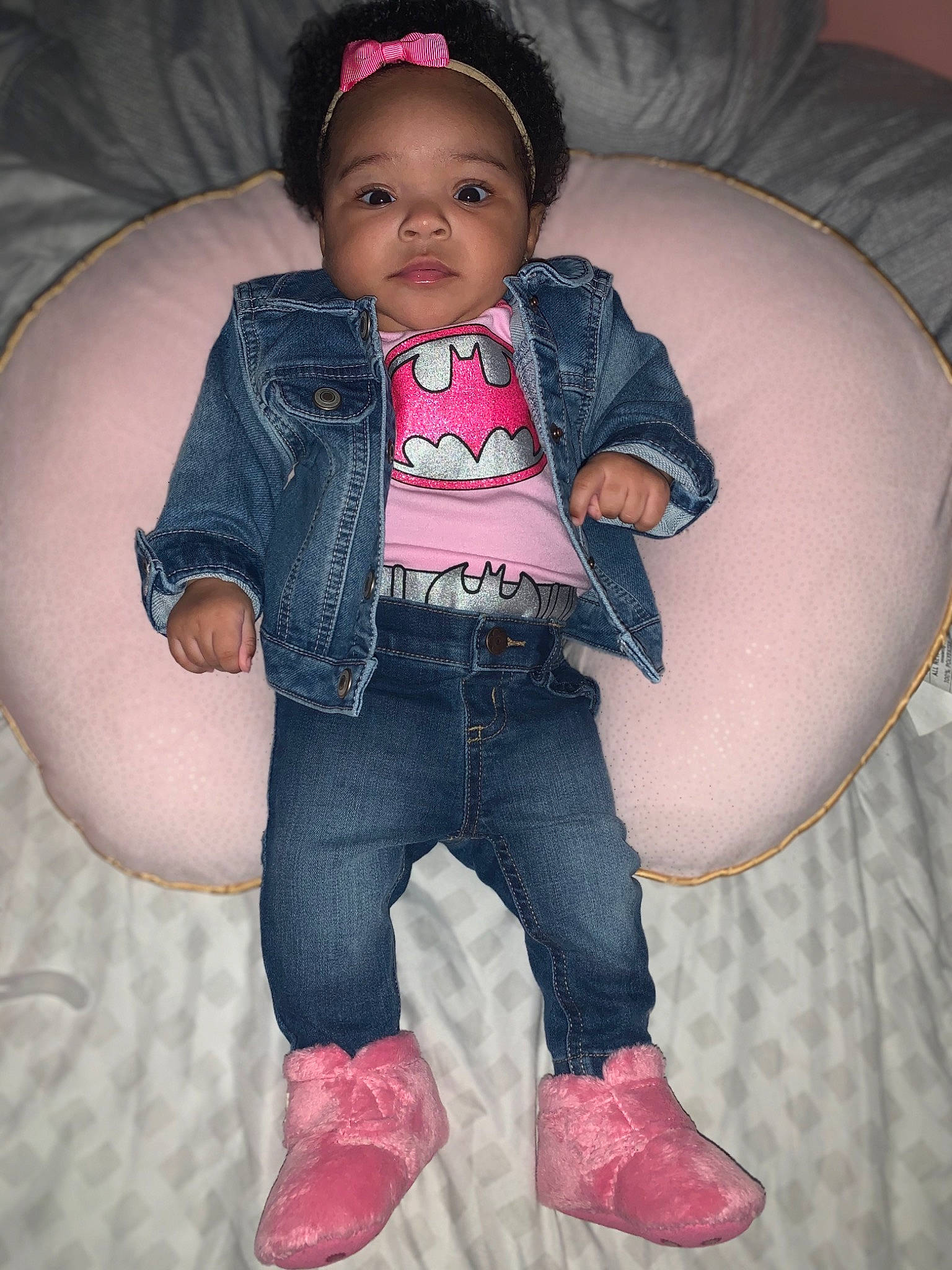 Avani is registered to the contest to win money with this photo: baby_toddler_clothing, boot, button, cheek, child_model, denim, embellishment, eye, hair_accessory, headband, jacket, jeans, mouth, nose, overall, person, pink, pocket, textile