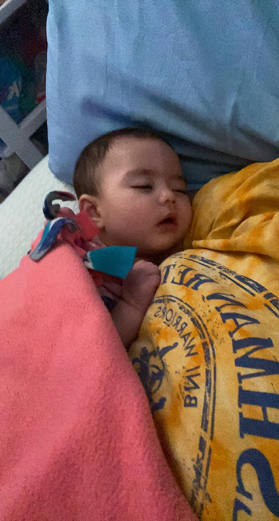 Luna is registered to the contest to win money with this photo: abdomen, arm, baby, chest, child, comfort, elbow, eye, finger, hair, head, human, human_leg, joint, linens, person, skin, t_shirt, temporary_tattoo, toddler