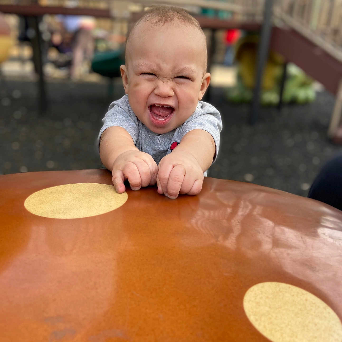 Isaiah is registered to the contest to win money with this photo: baby, babylaughing, diningtable, face, furniture, grass, happy, head, indoors, laughing, lighting, outdoorplayarea, outdoors, person, photography, playarea, plywood, portrait, table, wood