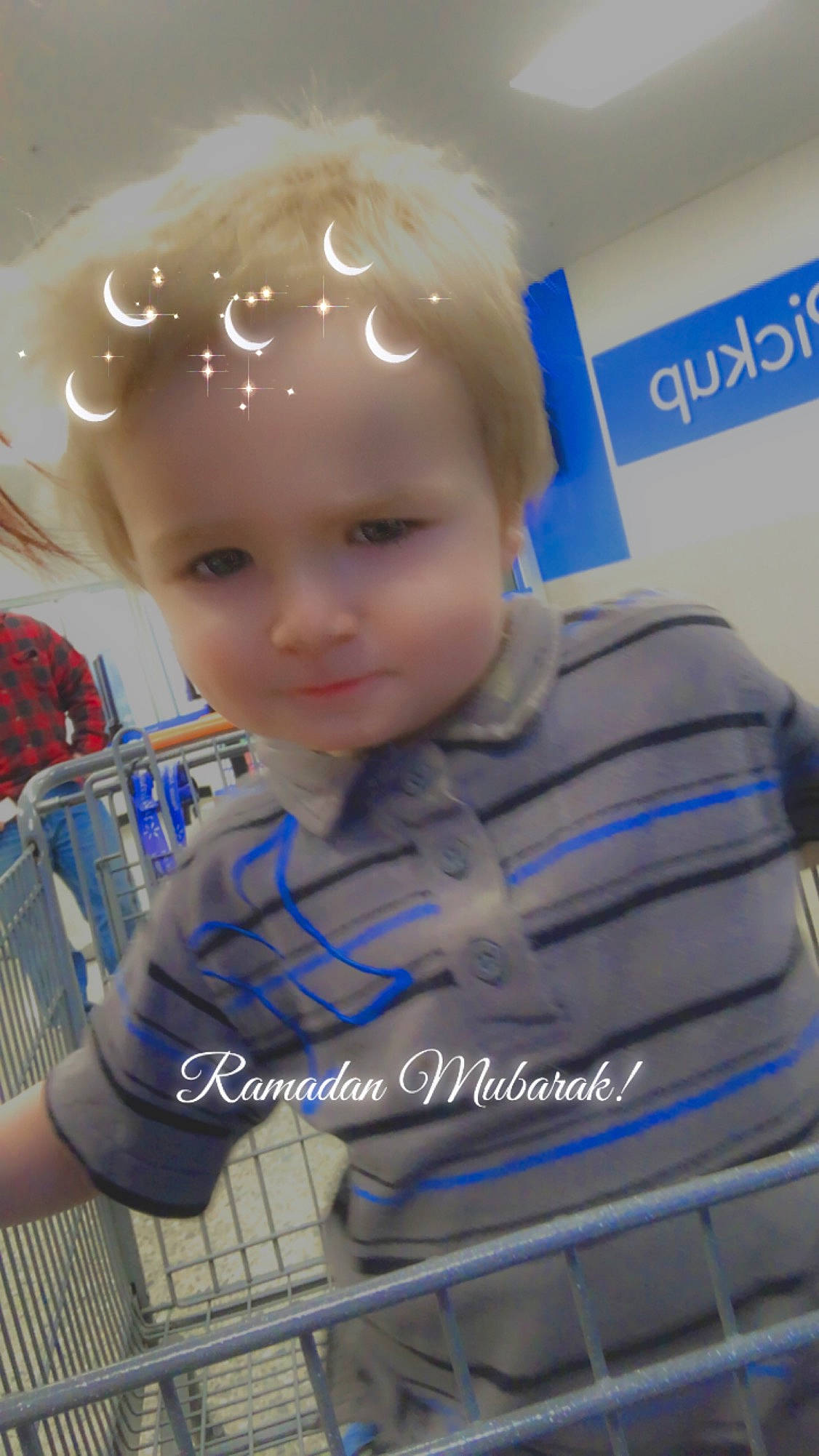 Darryl is registered to the contest to win money with this photo: baby, baby_products, baby_toddler_clothing, chair, cheek, child, electric_blue, fashion_accessory, fun, happy, headwear, iris, logo, person, personal_protective_equipment, plastic, retail, service, shopping_cart, sitting