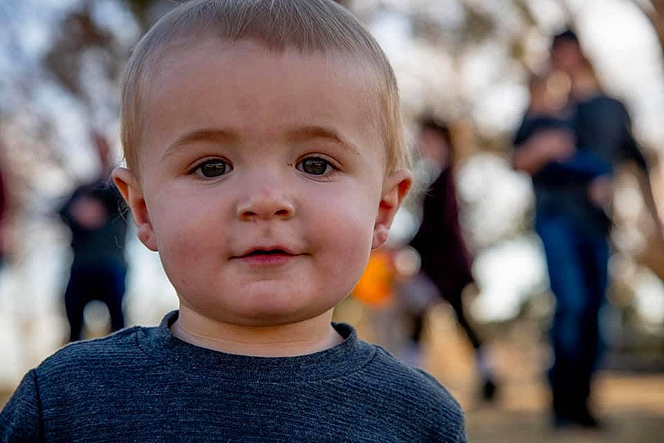 Darryl is registered to the contest to win money with this photo: baby, cheek, child, chin, close_up, eye, eyelash, face, flash_photography, fun, grass, happy, iris, leisure, nose, person, skin, smile, t_shirt, toddler