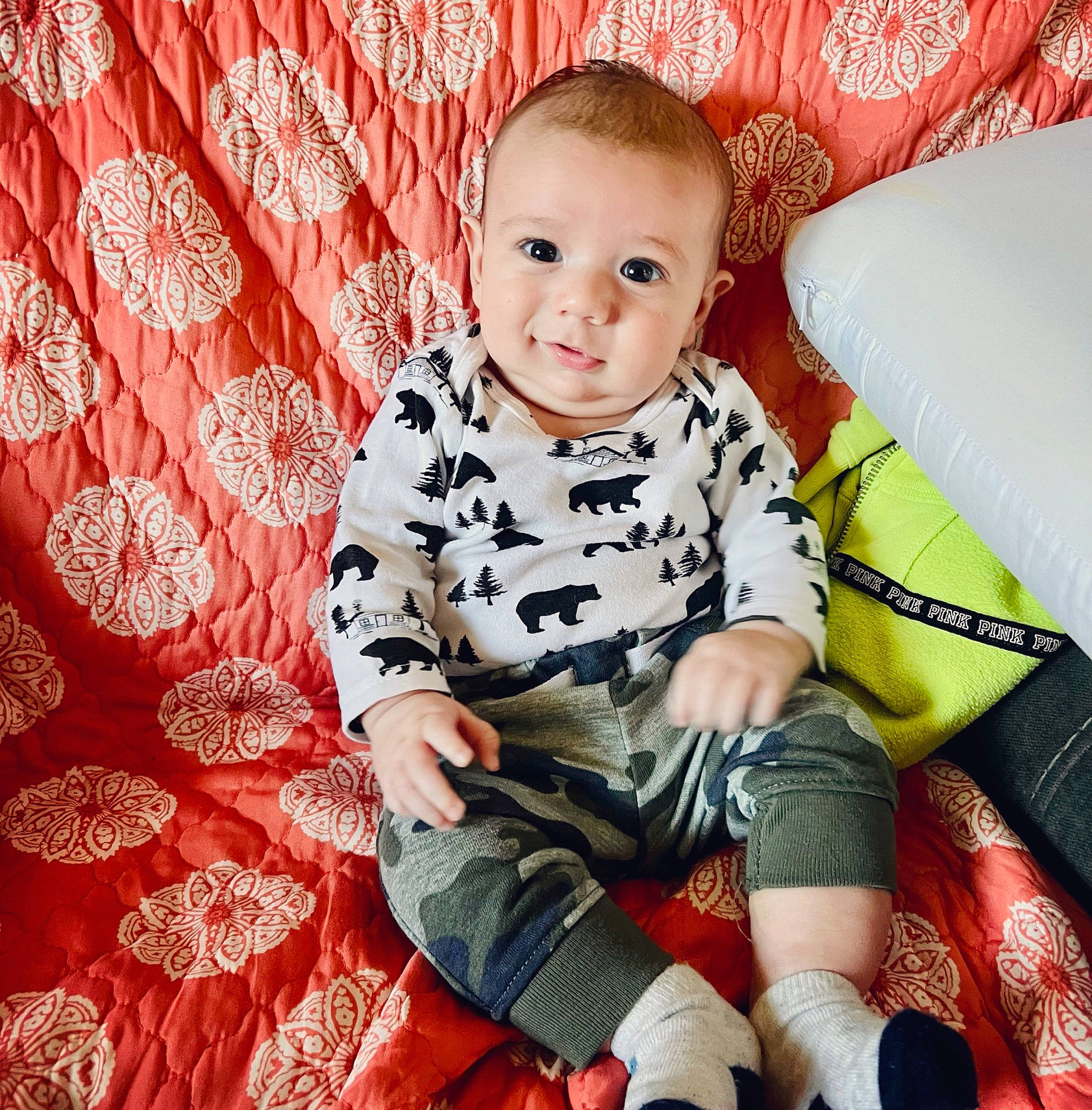 River is registered to the contest to win money with this photo: baby, baby_toddler_clothing, carmine, child, comfort, couch, happy, human, human_leg, knee, lap, pattern, person, red, sitting, sleeve, sock, standing, t_shirt, thigh