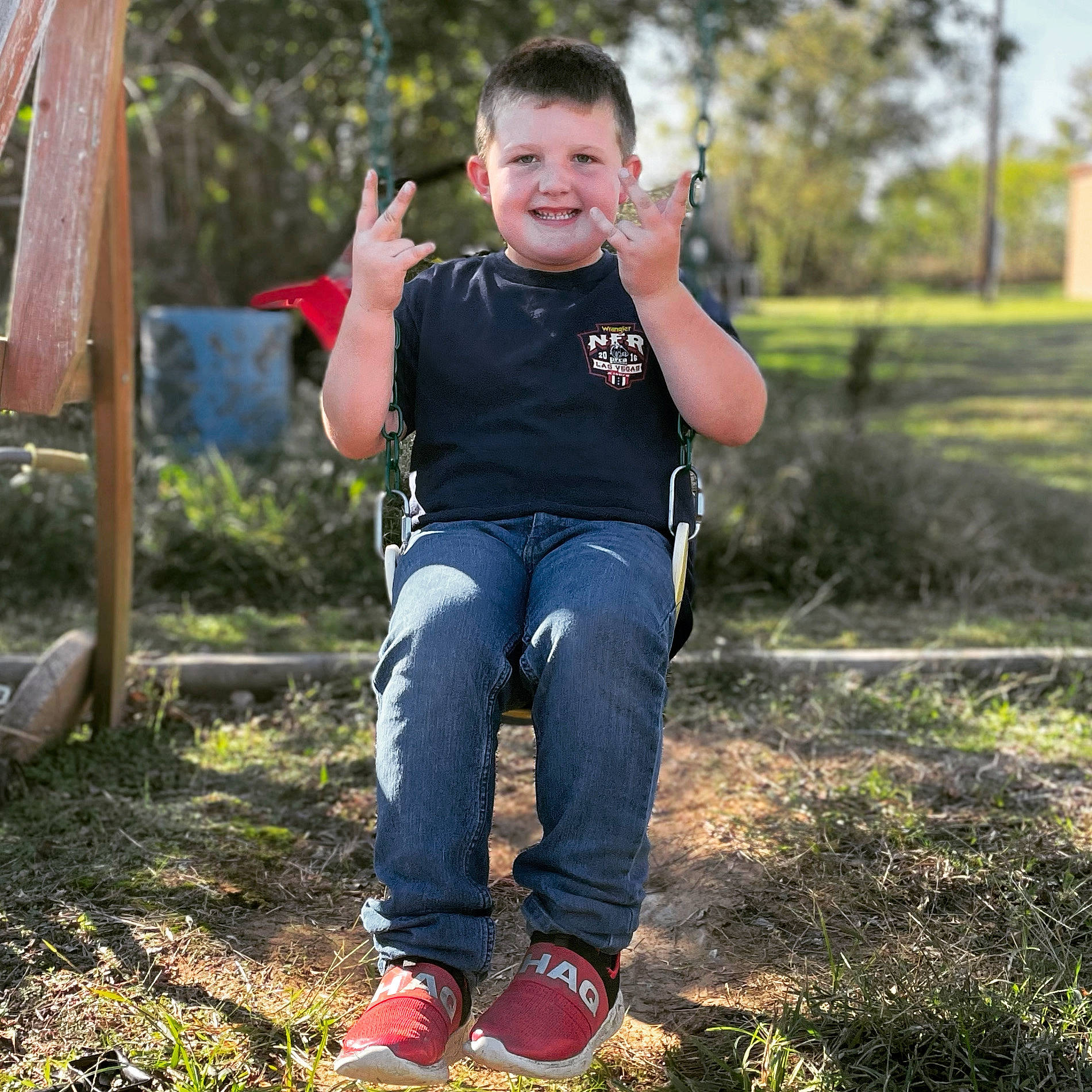 Brayden joined the competition — help win amazing prizes! child, denim, electric_blue, flash_photography, footwear, fun, grass, happy, joy, lawn, leaf, leisure, people_in_nature, person, plant, recreation, smile, sneakers, swing, t_shirt