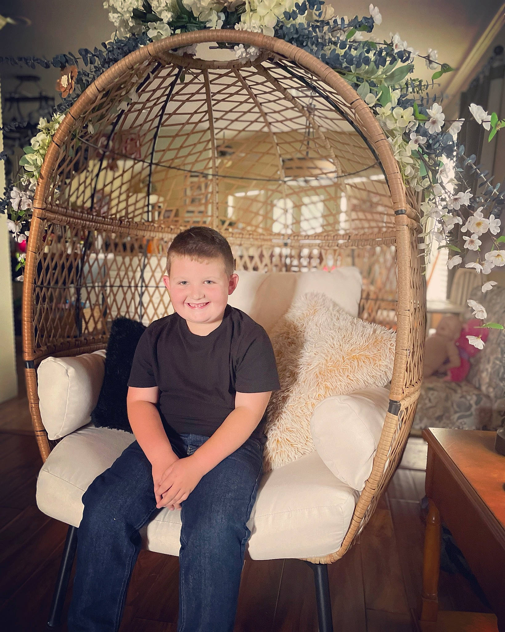 Brayden is registered to the contest to win money with this photo: arch, chair, child, christmas_decoration, circle, comfort, event, flash_photography, fun, furniture, hairstyle, joy, leisure, lighting_accessory, metal, ornament, person, sitting, sphere, twig