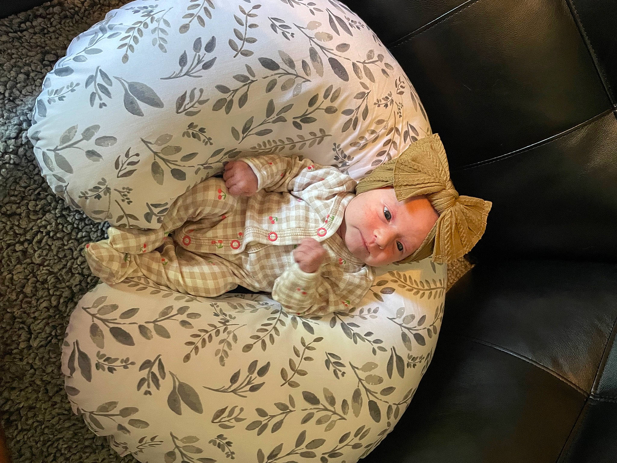 Nora is registered to the contest to win money with this photo: baby, baby_carriage, baby_products, baby_safety, baby_sleeping, baby_toddler_clothing, bedding, bedtime, child, comfort, head, headgear, human_body, linens, military_camouflage, nap, pattern, person, sitting, sleeve