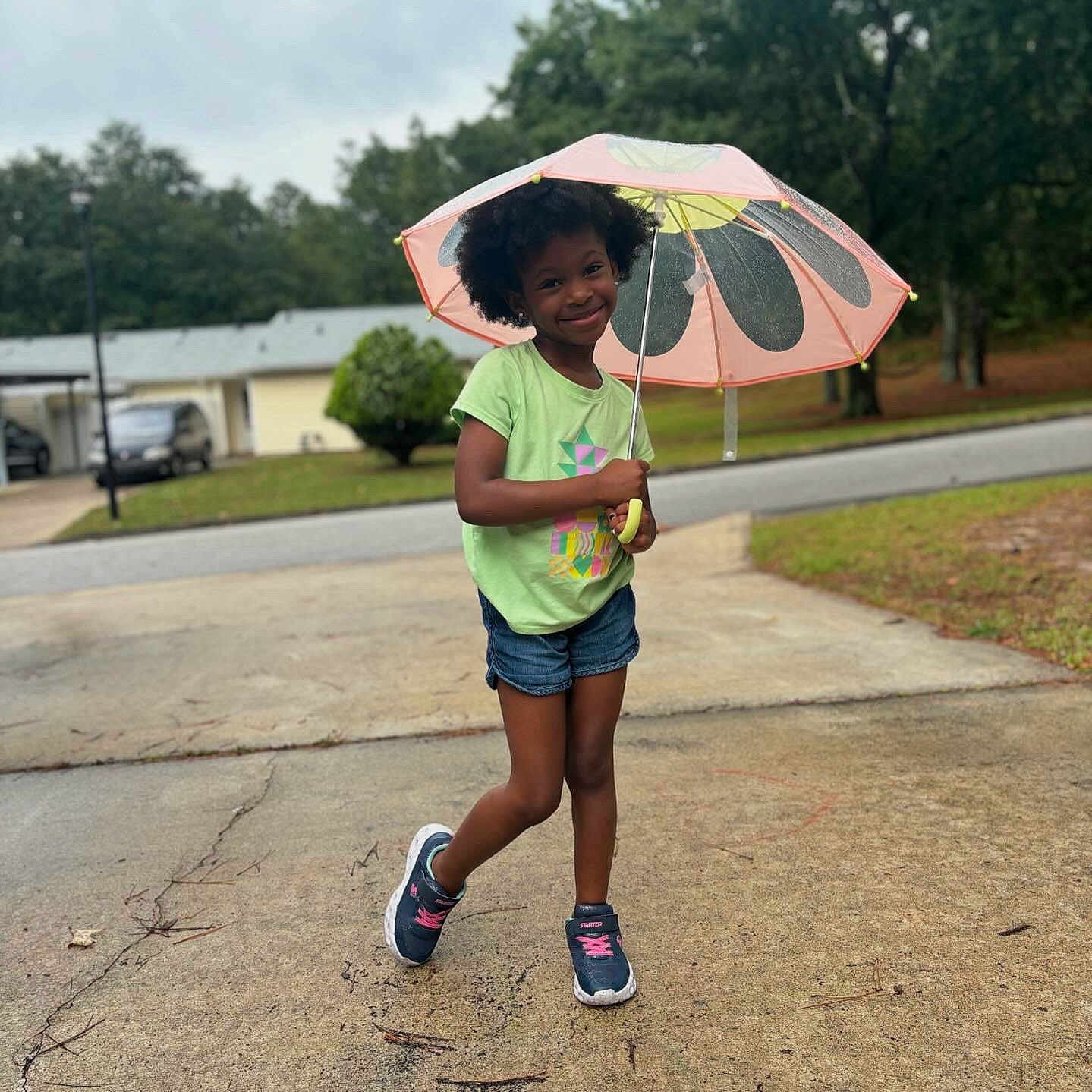 Nova joined the competition — help win amazing prizes! architecture, blackhair, building, child, city, clothing, face, female, girl, hair, head, pedestrian, person, road, shorts, sitting, sleeve, standing, street, urban