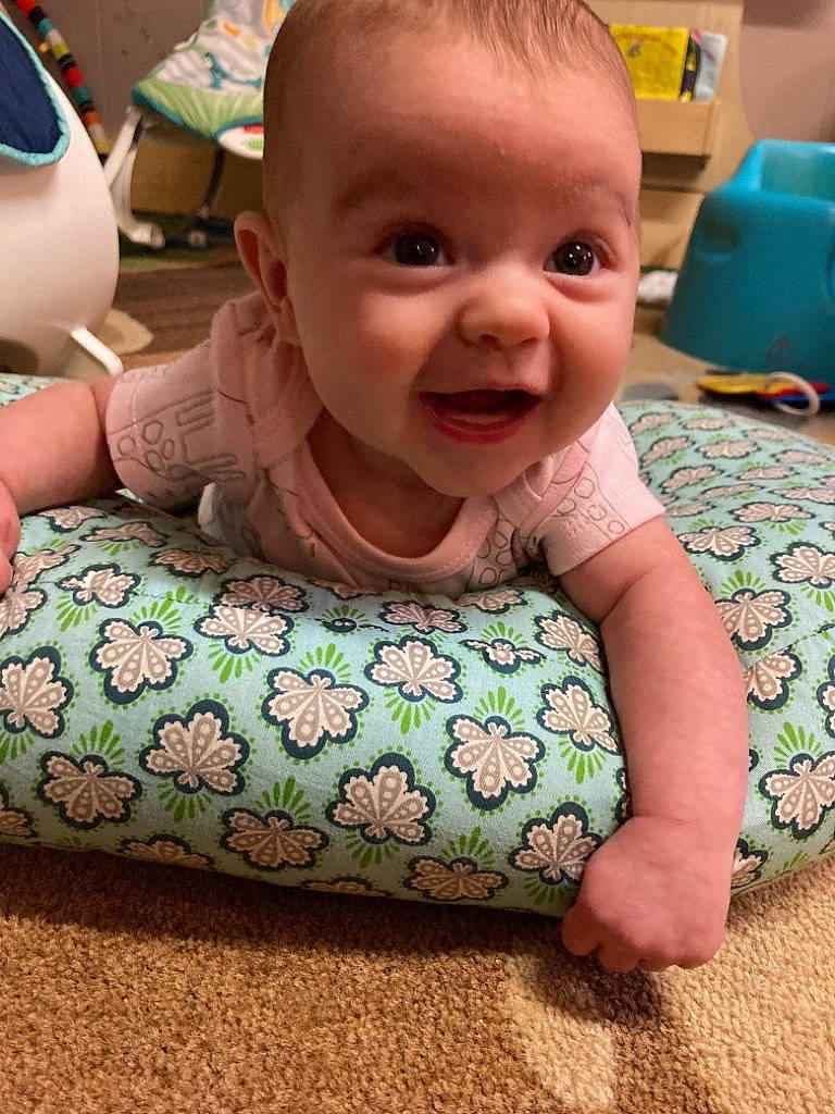 Jourdyn is registered to the contest to win money with this photo: baby, baby_toddler_clothing, cheek, child, chin, facial_expression, fun, green, hairstyle, happy, head, human_body, iris, mouth, nose, person, pink, skin, sleeve, smile