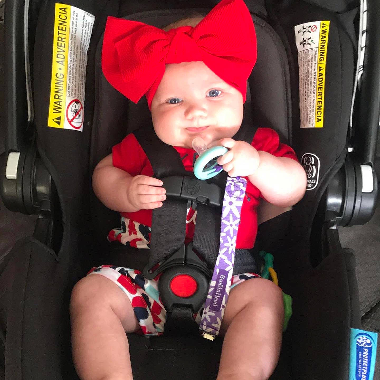 Gracie Ann joined the competition — help win amazing prizes! auto_part, baby, baby_carriage, baby_products, baby_safety, baby_toddler_clothing, bag, car_seat, comfort, finger, fun, headwear, lap, person, product, red, seat_belt, smile, steering_wheel, thigh
