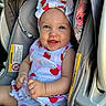 Everly joined the competition — help win amazing prizes! baby, child, car_seat, smiling, headband, strawberry_pattern, clothing, happy, infant, cute, sitting, portrait, person, seatbelt, car_interior, bright, skin, hand, face, eyes