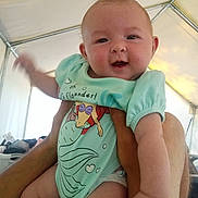 Addison joined the competition — help win amazing prizes! applique, baby, bodypart, clothing, couch, cushion, diaper, face, finger, furniture, hand, head, homedecor, newborn, person, photography, portrait, shorts, sitting, t_shirt