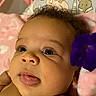 Jacie is registered to the contest to win money with this photo: adorable, baby, blanket, child, closeup, cute, expression, eyes, face, flower, hair, head, indoors, infant, lying_down, pink_blanket, purple_flower, skin, soft, tongue