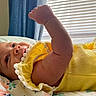 Jacie joined the competition — help win amazing prizes! baby, bed, blanket, child, closeup, curtains, cute, floral_pattern, furniture, indoor, infant, lying_down, peaceful, portrait, raised_arm, skin, sleepwear, soft_light, window_blinds, yellow_clothing