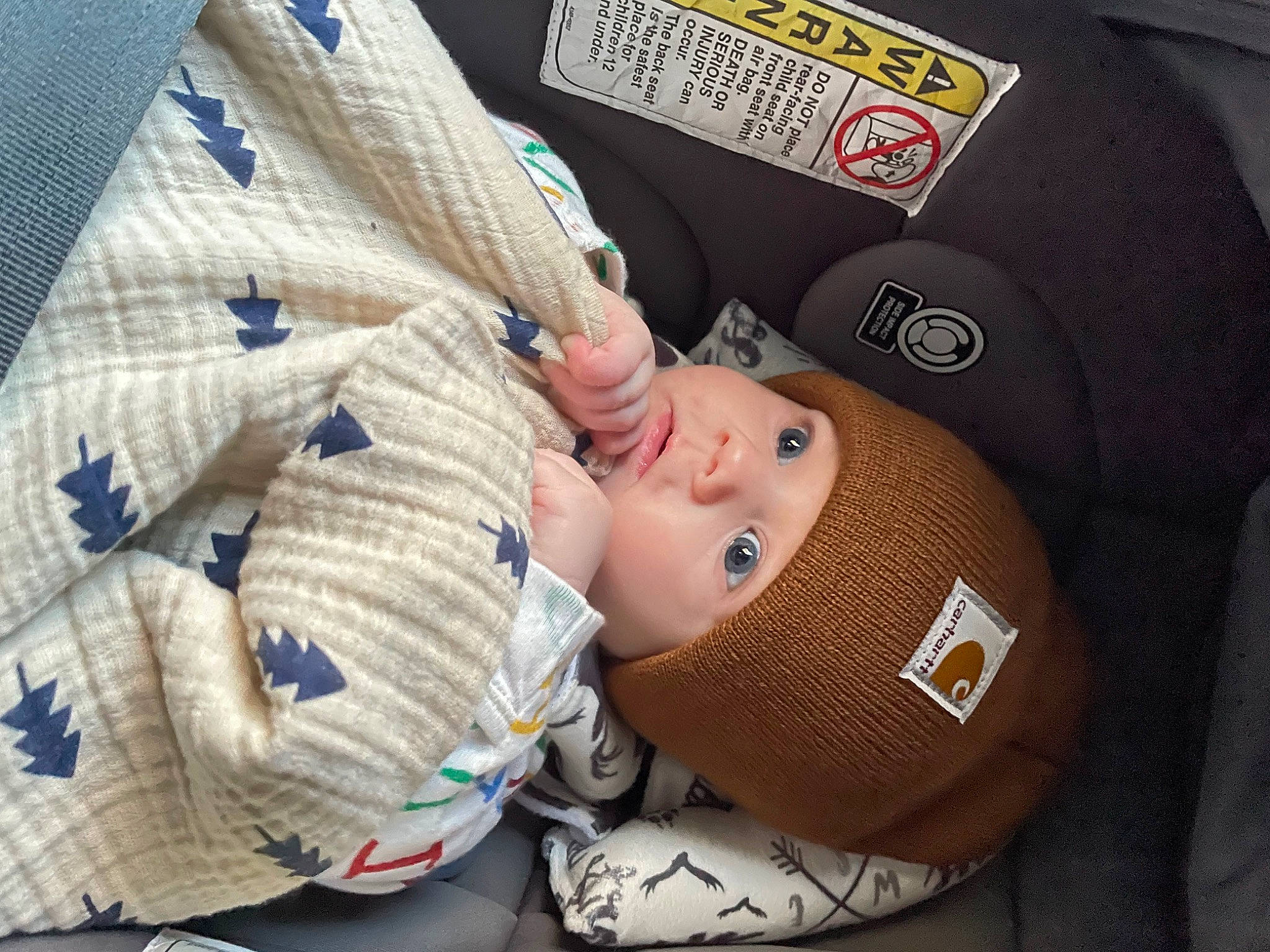 Laine is registered to the contest to win money with this photo: arm, baby, baby_products, baby_sleeping, baby_toddler_clothing, cap, child, comfort, elbow, fashion_accessory, gesture, headwear, linens, nail, pattern, person, product, sleeve, thumb, toddler