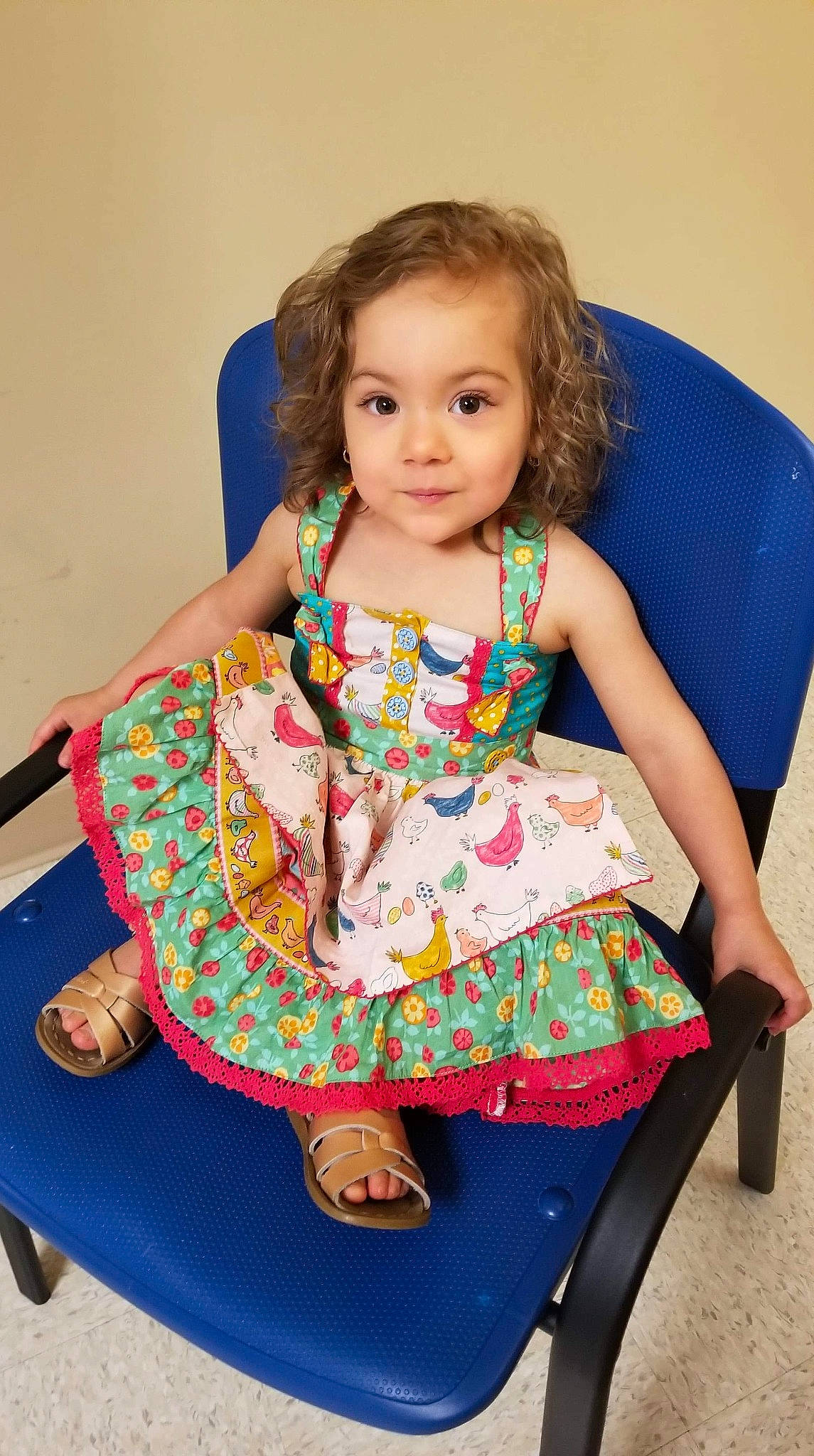 Mavis is registered to the contest to win money with this photo: baby, cheek, child, child_model, dress, pattern, person, sitting, toddler