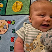 Alister joined the competition — help win amazing prizes! baby, infant, smiling, striped_clothing, lion_print, blanket, numbers, months_badge, winnie_the_pooh, eeyore, milestone, cute, lying_down, child, soft_toy, colorful, happy, closeup, portrait, young