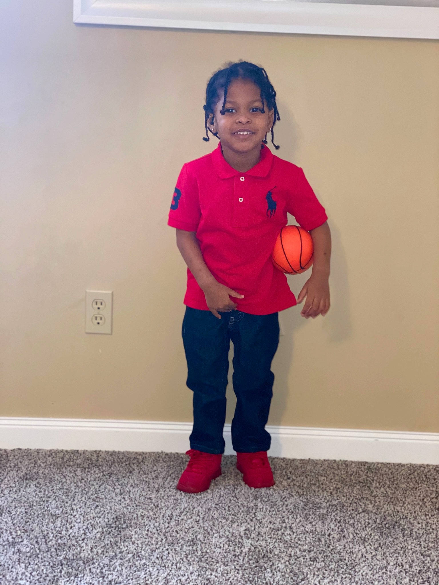 Toquan is registered to the contest to win money with this photo: arm, child, finger, footwear, human_body, joint, joy, knee, leg, magenta, outerwear, person, pink, red, room, shoe, shoulder, standing, t_shirt, toddler