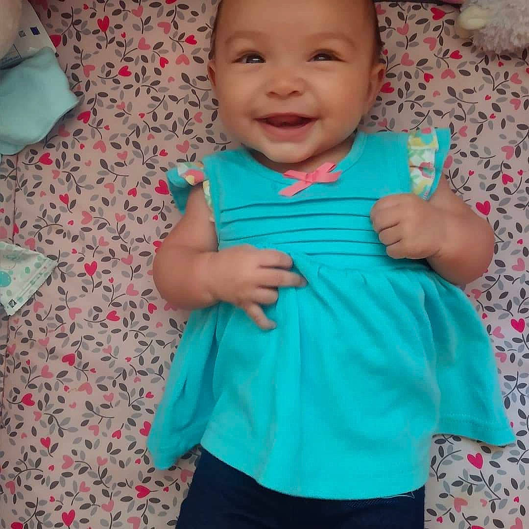 Odessa joined the competition — help win amazing prizes! aqua, arm, baby, baby_toddler_clothing, blue, cheek, child, clothing, dress, face, green, head, headwear, joy, person, product, skin, sleeve, smile, teal