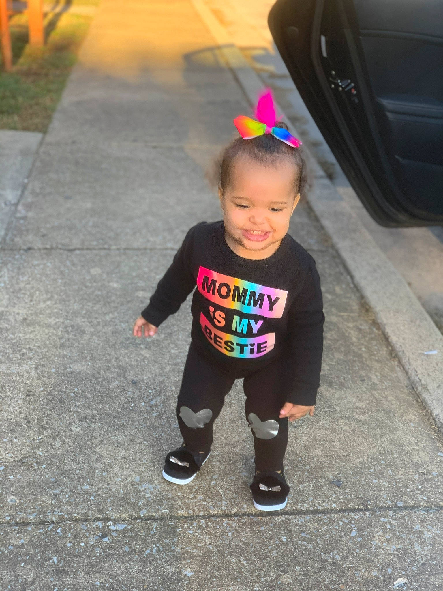 Azalea is registered to the contest to win money with this photo: asphalt, child, fun, head, headgear, joy, person, pink, purple, skin, smile, t_shirt, toddler, vacation, walking