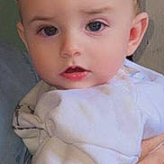 Caolán joined the competition — help win amazing prizes! baby, child, face, eyes, hair, hand, blanket, white_clothing, portrait, closeup, skin, infant, cute, person, human, indoor, soft_light, expression, young, holding